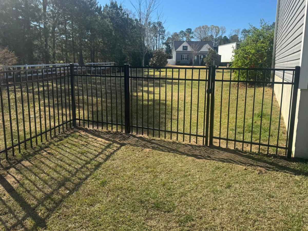 aluminum residential fence with gate in Fayetteville, NC featuring secure latch